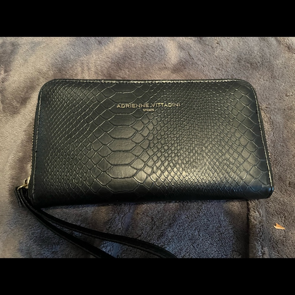 Clutch wallet with built in phone charger